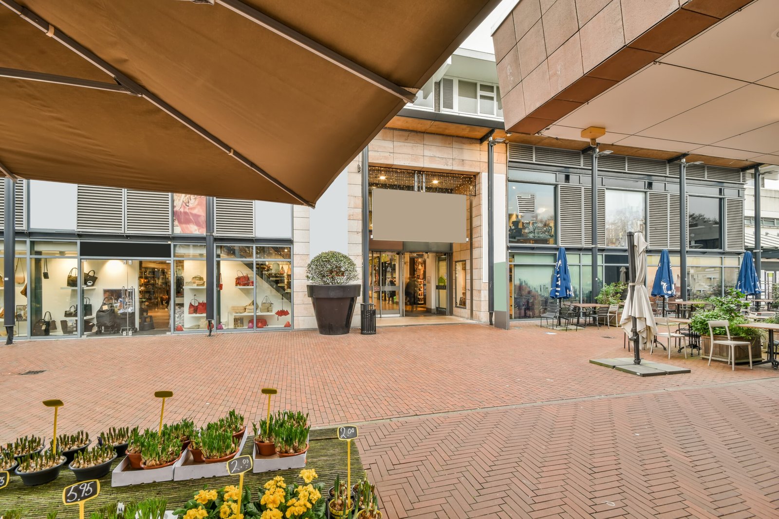 Urban view with a brick floor and a small cafe
